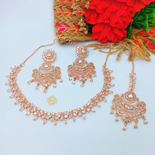 American Diamond Rose Gold Jewellery Set With Earrings and Maangtikka.