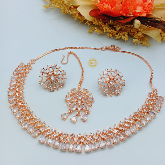 American Diamond Rose Gold Jewellery Set With Earrings and Maangtikka.