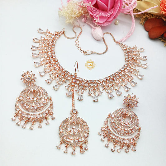 American Diamond Rose Gold Jewellery Set With Earrings and Maangtikka.