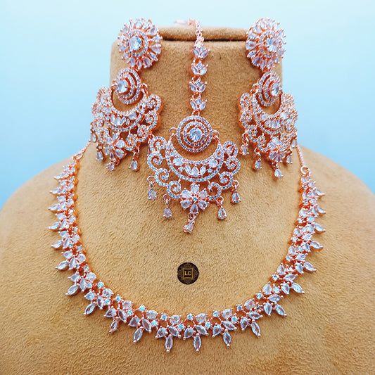 American Diamond Rose Gold Jewellery Set With Earrings and Maangtikka.
