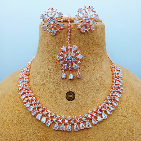 American Diamond Rose Gold Jewellery Set With Earrings and Maangtikka.