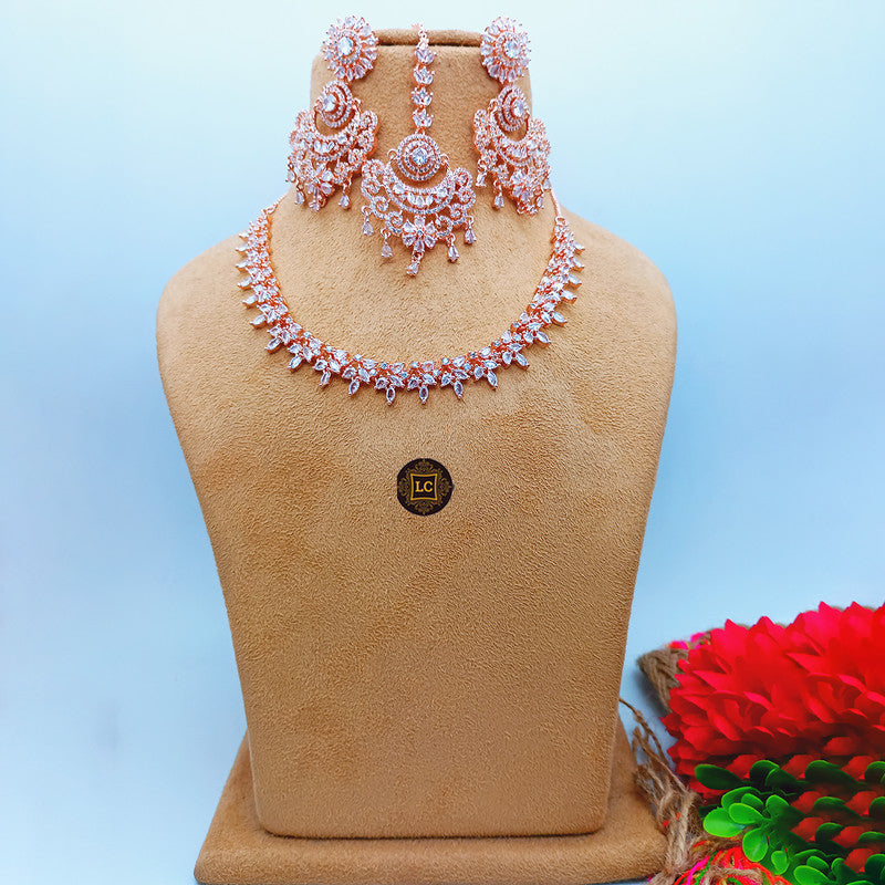 American Diamond Rose Gold Jewellery Set With Earrings and Maangtikka.