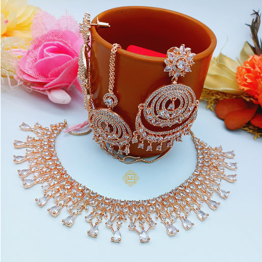 American Diamond Rose Gold Jewellery Set With Earrings and Maangtikka.