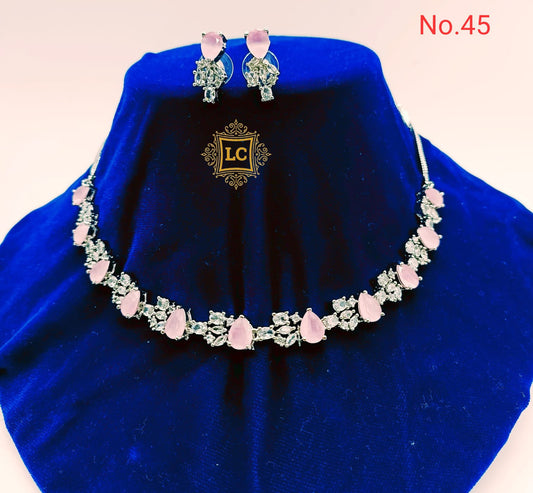 American Diamond Silver Jewellery Set With Earrings and Maangtikka.