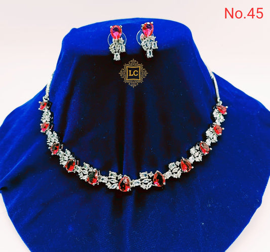 American Diamond Silver Jewellery Set With Earrings and Maangtikka.